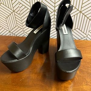 Steve Madden black platform heels.